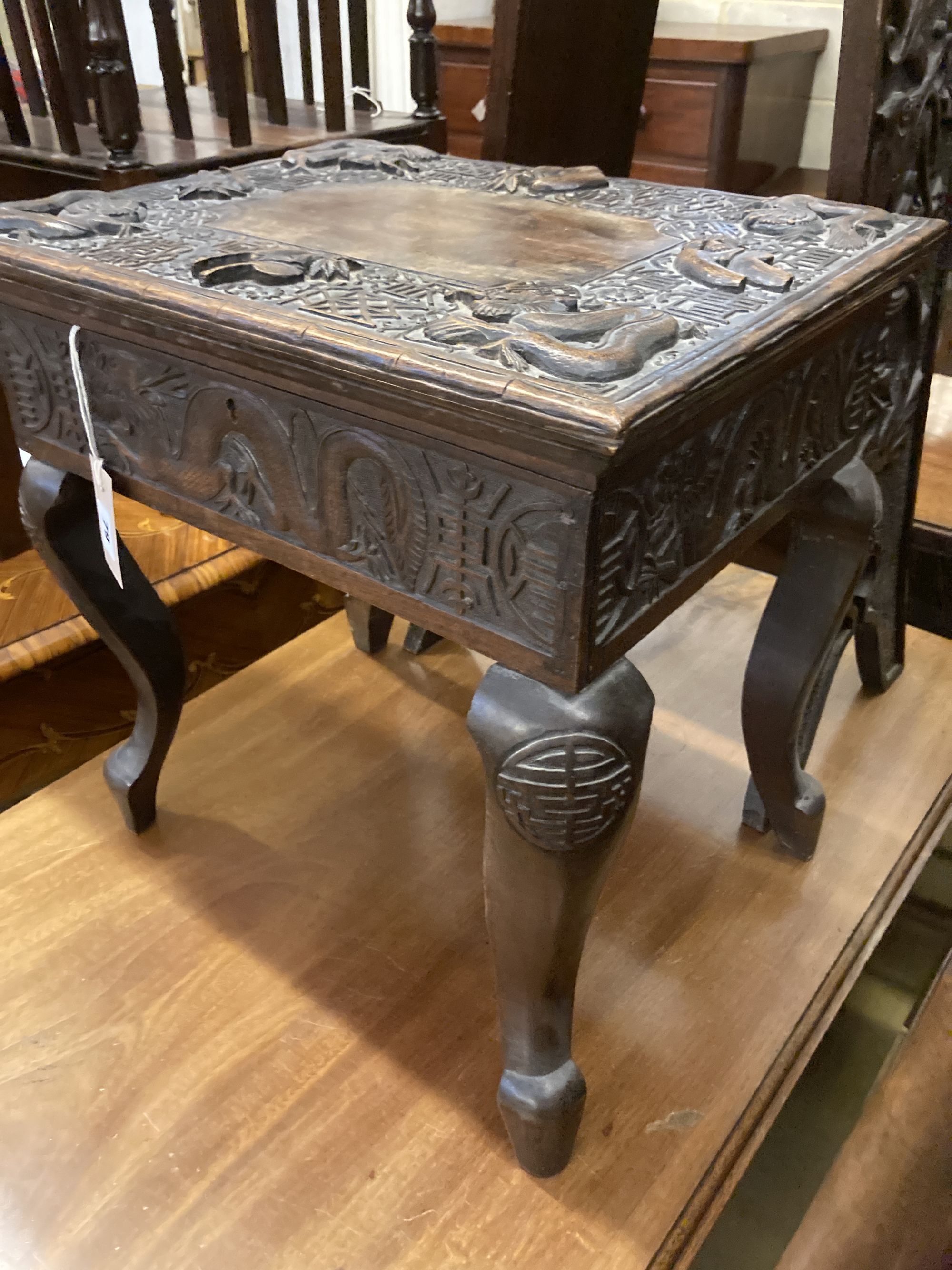 A Burmese carved box seat stool, width 44cm, depth 34cm, height 45cm and a similar two tier plant stand